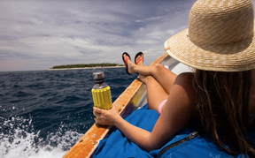 a woman enjoying her vacation with Mobot foam roller water bottle for hydration