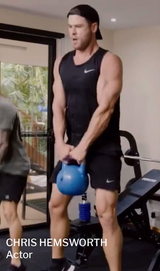 chris hemsworth actor using mobot foam roller water bottle 