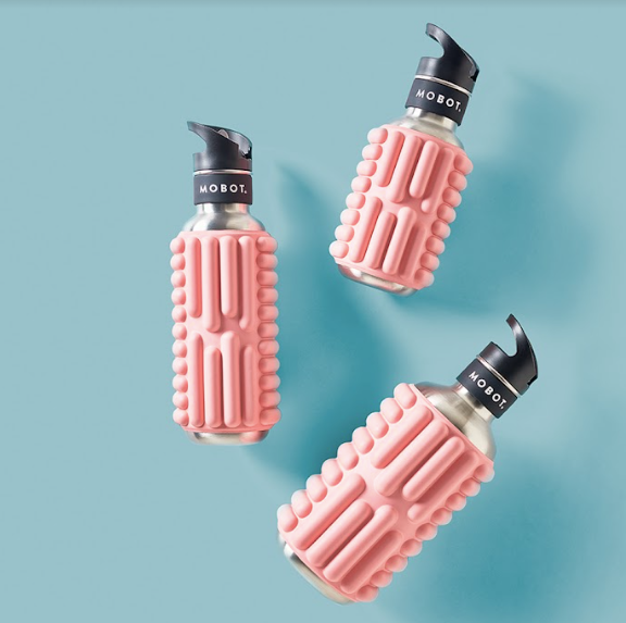 3 pink 18oz 27oz and 40oz Mobot foam roller water bottles on a blue background